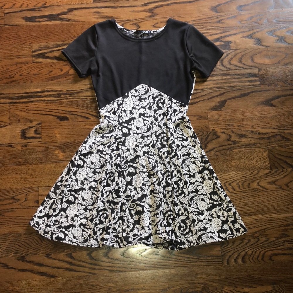 Black and white, just above the knee length, dress